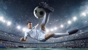 A male soccer player makes a dramatic play by jumping horizontally. He attempts to kick the ball with his feet. The stadium is dark behind him. Only the lights of the stadium shine brightly, creating a halo effect around the bulbs. [url=http://www.istockphoto.com/search/lightbox/14599908#196ad674][img]https://lh6.googleusercontent.com/-GdFQEhB66bg/VClu4QW_BKI/AAAAAAAAAuc/89hxSrSE5Fc/s380/SOCCER.jpg[/img][/url] [url=http://www.istockphoto.com/search/lightbox/14599864#18270031][img]https://lh3.googleusercontent.com/-D38pCIGnaRo/VClu4my_I1I/AAAAAAAAAu0/g6eFnALD8h8/s380/SOCCER_BG.jpg[/img][/url] [url=http://www.istockphoto.com/search/lightbox/14599836#164d2c1c][img]https://lh3.googleusercontent.com/-Hd-TF-pojAo/VClu3s6LoQI/AAAAAAAAAu4/ZUdk_NHstFI/s380/ISO_SOCCER.jpg[/img][/url]
